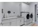 Laundry room featuring granite counters, white cabinetry, and modern appliances at 24738 N 175Th Ave, Surprise, AZ 85387