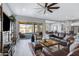 Spacious living area with sliding glass doors, leather furniture, and an open layout at 24738 N 175Th Ave, Surprise, AZ 85387