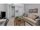 Comfortable living room showcases neutral paint, a plush sofa, and stylish decor at 24738 N 175Th Ave, Surprise, AZ 85387