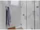 Modern walk-in shower featuring white subway tile, a glass enclosure, and a built-in bench at 24738 N 175Th Ave, Surprise, AZ 85387