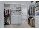 Bright walk-in closet with white shelving, drawers, and custom storage solutions for optimal organization at 24738 N 175Th Ave, Surprise, AZ 85387