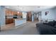 Open kitchen flows into the living room with granite countertops and stainless steel appliances at 35730 N Pommel Pl, San Tan Valley, AZ 85144