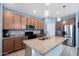Modern kitchen boasting granite counters, stainless steel appliances, and ample cabinet space at 35730 N Pommel Pl, San Tan Valley, AZ 85144
