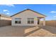 Spacious backyard with a covered patio, ideal for outdoor relaxation and entertaining at 3746 S 234Th Ln, Buckeye, AZ 85326