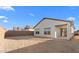 Large backyard with a covered patio and ample space for outdoor activities at 3746 S 234Th Ln, Buckeye, AZ 85326