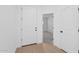 Welcoming entryway with light wood flooring and white doors leading to other rooms at 3746 S 234Th Ln, Buckeye, AZ 85326