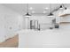 Modern kitchen with white cabinets, stainless steel appliances, and bar seating at the island at 3746 S 234Th Ln, Buckeye, AZ 85326