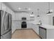 Bright kitchen featuring white cabinetry, stainless steel appliances, and a sleek countertop at 3746 S 234Th Ln, Buckeye, AZ 85326