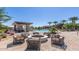 Community pool area features a fire pit and cozy seating, perfect for relaxing by the water at 39801 N Trajen Pl, San Tan Valley, AZ 85140