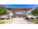 Poolside bar and cabana with built-in grills offer a luxurious outdoor cooking and dining experience at 39801 N Trajen Pl, San Tan Valley, AZ 85140