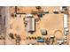 Aerial view of property showing home, covered parking, corral, storage buildings, and large lot at 404 W Galvin St, Phoenix, AZ 85086