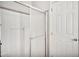 Bathroom shower with glass doors and a white door at 404 W Galvin St, Phoenix, AZ 85086