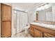 Bathroom featuring patterned tile floor, a wood cabinet vanity, and a shower with a curtain at 404 W Galvin St, Phoenix, AZ 85086