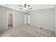 Large primary bedroom offers multiple closets and a ceiling fan at 404 W Galvin St, Phoenix, AZ 85086