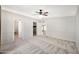 Neutral bedroom with ceiling fan and doorways leading to en suite at 404 W Galvin St, Phoenix, AZ 85086