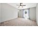 Carpeted bedroom with a large window and soft curtains at 404 W Galvin St, Phoenix, AZ 85086
