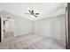 Spacious carpeted bedroom with a ceiling fan and natural light at 404 W Galvin St, Phoenix, AZ 85086