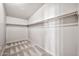 Empty walk-in closet with neutral carpet and white walls at 404 W Galvin St, Phoenix, AZ 85086