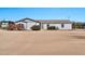 Single story ranch house with a desert landscape, rock garden, and flag pole at 404 W Galvin St, Phoenix, AZ 85086