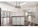 Kitchen and Living Room featuring white cabinets, stainless appliances and hardwood flooring at 404 W Galvin St, Phoenix, AZ 85086