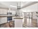 Bright kitchen features white cabinets, stainless steel appliances, and a skylight at 404 W Galvin St, Phoenix, AZ 85086