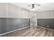 Open living room showcasing wood floors, decorative walls and a modern ceiling fan at 404 W Galvin St, Phoenix, AZ 85086