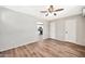 Spacious living area featuring wood-look floors and clear sight lines into the kitchen at 404 W Galvin St, Phoenix, AZ 85086