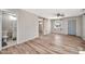 Open living space with wood floors, a barn door, and access to a bathroom at 404 W Galvin St, Phoenix, AZ 85086