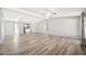 Spacious living room with wood floors, ceiling fans and natural light at 404 W Galvin St, Phoenix, AZ 85086