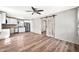 Modern open concept living space with stainless steel appliances and barn door at 404 W Galvin St, Phoenix, AZ 85086