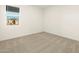 Comfortable carpeted bedroom with a window, offering a bright and airy space at 4332 W Hannah St, San Tan Valley, AZ 85144