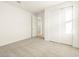 Cozy bedroom featuring carpet, closet, and a door leading to another room at 4332 W Hannah St, San Tan Valley, AZ 85144