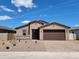 Charming single-story home featuring desert landscaping, a two-car garage, and a welcoming front entryway at 4332 W Hannah St, San Tan Valley, AZ 85144