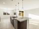 Modern kitchen featuring a spacious island with a sink, granite countertops, and stainless steel appliances at 4332 W Hannah St, San Tan Valley, AZ 85144