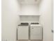 Functional laundry area featuring a side-by-side washer and dryer and a shelf for storage at 4332 W Hannah St, San Tan Valley, AZ 85144