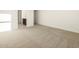 Comfortable living area featuring neutral carpeting and baseboards for a simple, modern feel at 4332 W Hannah St, San Tan Valley, AZ 85144