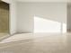 Bright open living room with large sliding glass door at 4332 W Hannah St, San Tan Valley, AZ 85144
