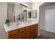 Well-lit bathroom featuring double sinks and modern fixtures at 45583 W Sheridan W Rd, Maricopa, AZ 85139
