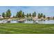 Beautiful community lake surrounded by mature trees and landscaping, creating a serene environment at 45583 W Sheridan W Rd, Maricopa, AZ 85139
