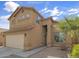 Charming two-story home with a well-maintained yard and an attached two-car garage at 45583 W Sheridan W Rd, Maricopa, AZ 85139
