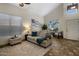 Bright living room with comfortable seating, natural light, and tasteful decor, ideal for relaxation at 45583 W Sheridan W Rd, Maricopa, AZ 85139