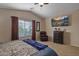 Comfortable main bedroom with TV and natural light at 45583 W Sheridan W Rd, Maricopa, AZ 85139
