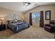 Spacious main bedroom with vaulted ceiling and a comfortable bed at 45583 W Sheridan W Rd, Maricopa, AZ 85139