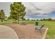Park area featuring benches, picnic tables and mature trees at 45583 W Sheridan W Rd, Maricopa, AZ 85139