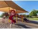 Shaded playground area with slides and climbing structures at 45583 W Sheridan W Rd, Maricopa, AZ 85139