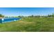 A community pond surrounded by a grassy area at 45583 W Sheridan W Rd, Maricopa, AZ 85139