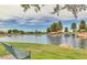 A tranquil pond surrounded by greenery with a rock waterfall at 45583 W Sheridan W Rd, Maricopa, AZ 85139