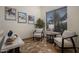 Comfortable sitting area with neutral tones, a marble top table, and art, creating a relaxing space at 45583 W Sheridan W Rd, Maricopa, AZ 85139