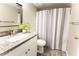 Well-lit bathroom with granite countertop vanity and stylish shower curtain at 4600 N 68Th St # 368, Scottsdale, AZ 85251