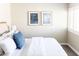 Bedroom featuring a bed with stylish blue accent pillows and attractive artwork at 4600 N 68Th St # 368, Scottsdale, AZ 85251